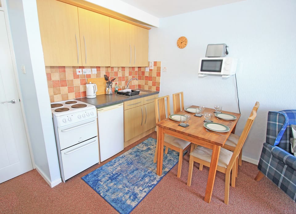 Fridge, electric kettle, toaster, cookware/dishes/utensils