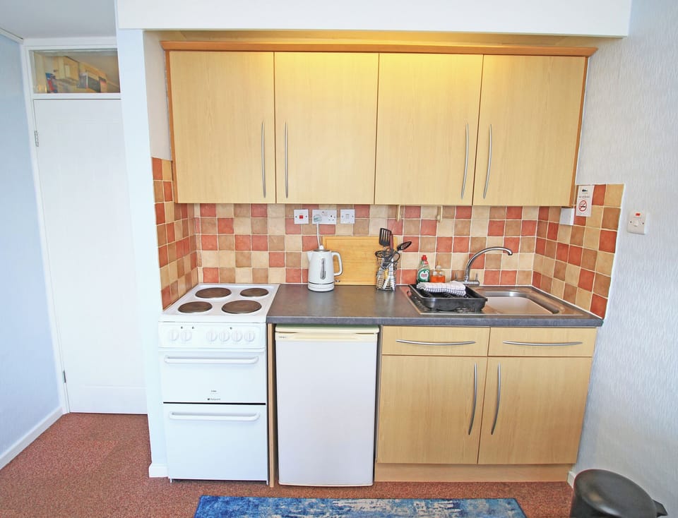 Fridge, electric kettle, toaster, cookware/dishes/utensils