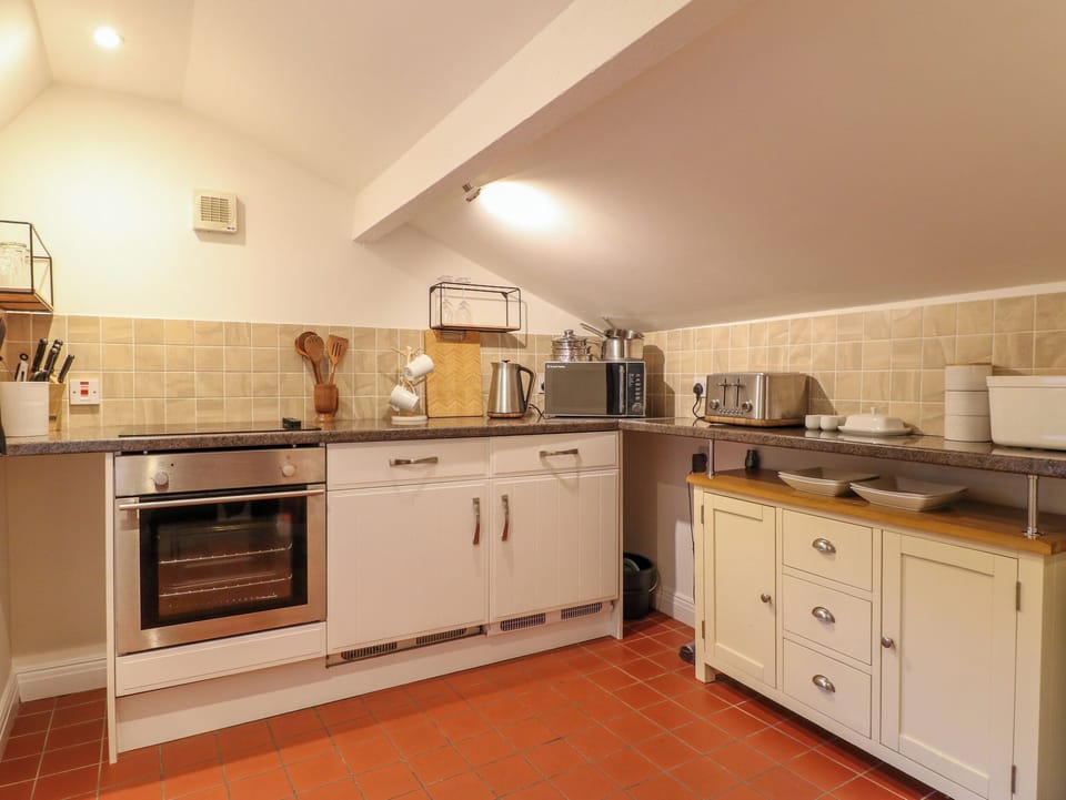 Fridge, electric kettle, toaster, cookware/dishes/utensils
