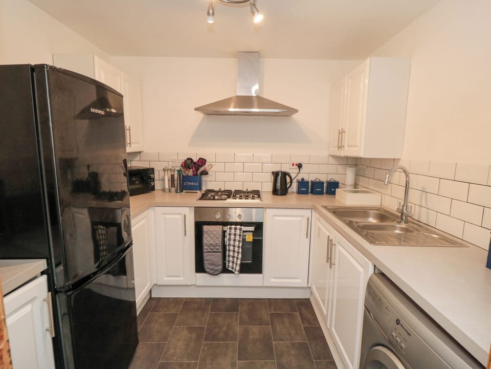 Fridge, electric kettle, cookware/dishes/utensils