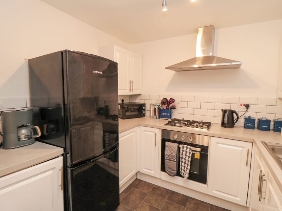 Fridge, electric kettle, cookware/dishes/utensils
