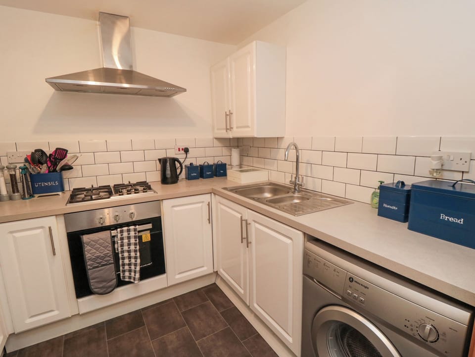 Fridge, electric kettle, cookware/dishes/utensils