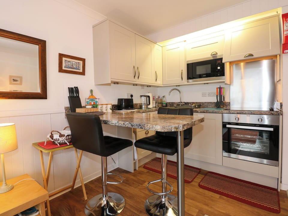 Fridge, electric kettle, toaster, cookware/dishes/utensils