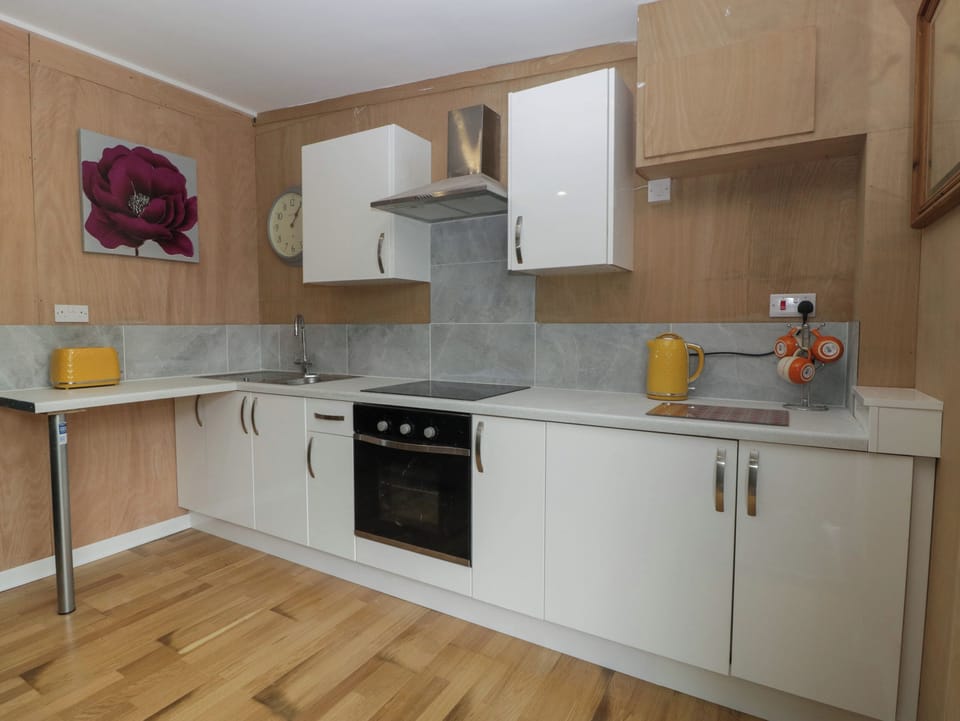 Fridge, electric kettle, toaster, cookware/dishes/utensils