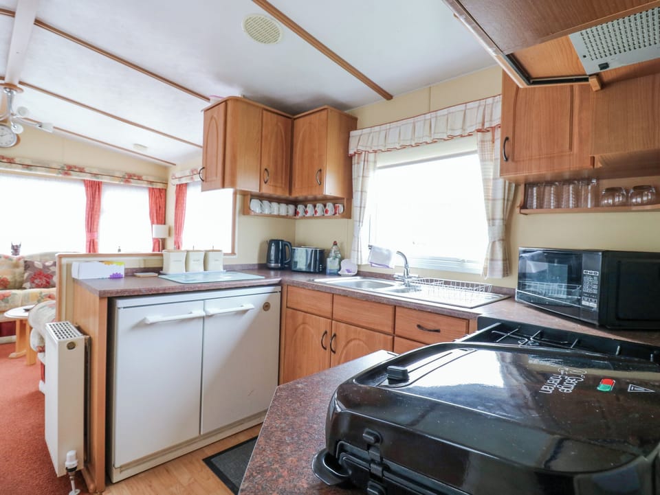 Fridge, electric kettle, toaster, cookware/dishes/utensils