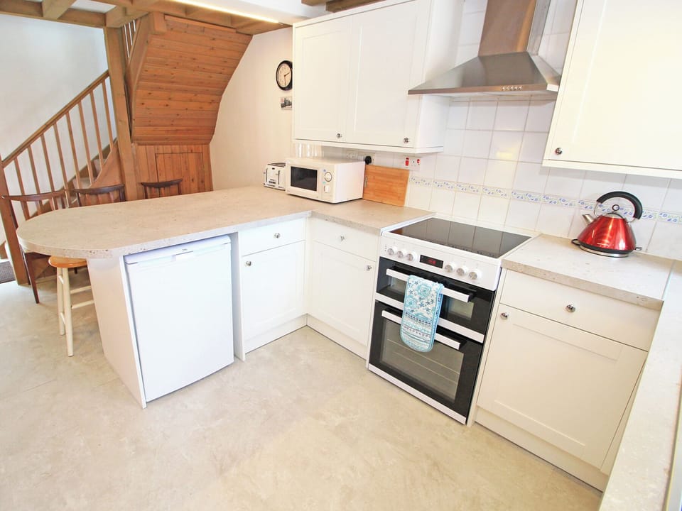 Fridge, electric kettle, toaster, cookware/dishes/utensils