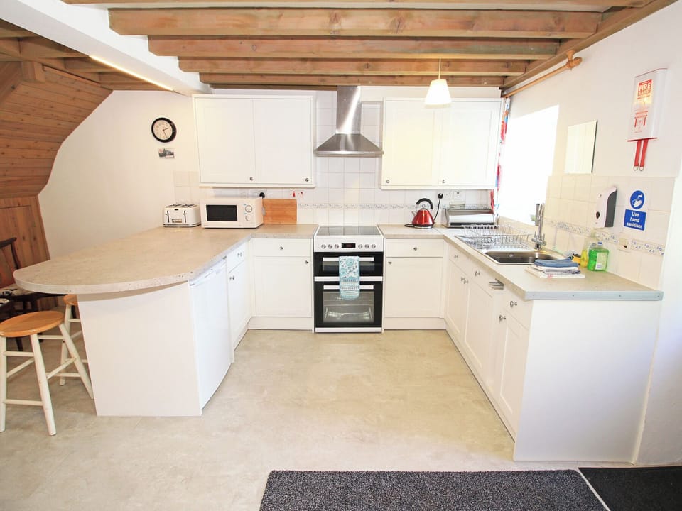Fridge, electric kettle, toaster, cookware/dishes/utensils