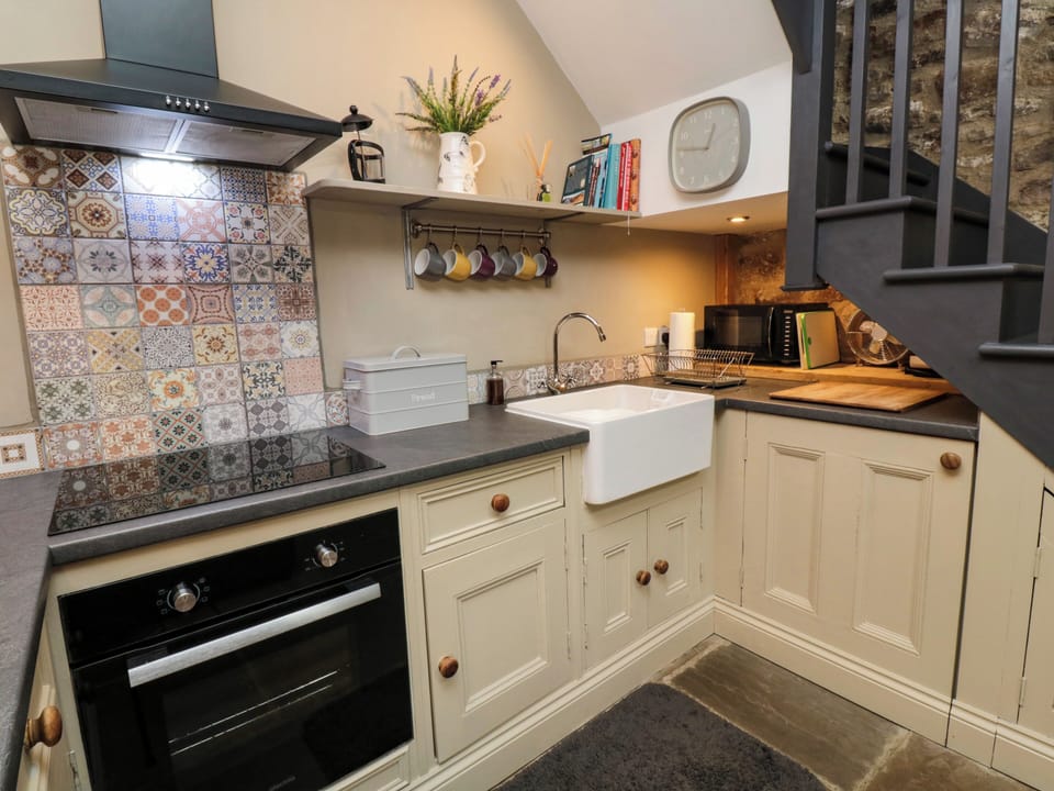 Fridge, electric kettle, toaster, cookware/dishes/utensils