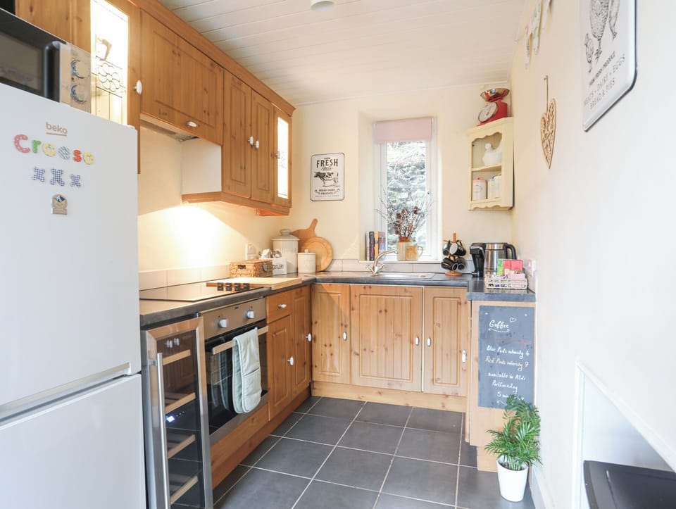 Fridge, electric kettle, cookware/dishes/utensils