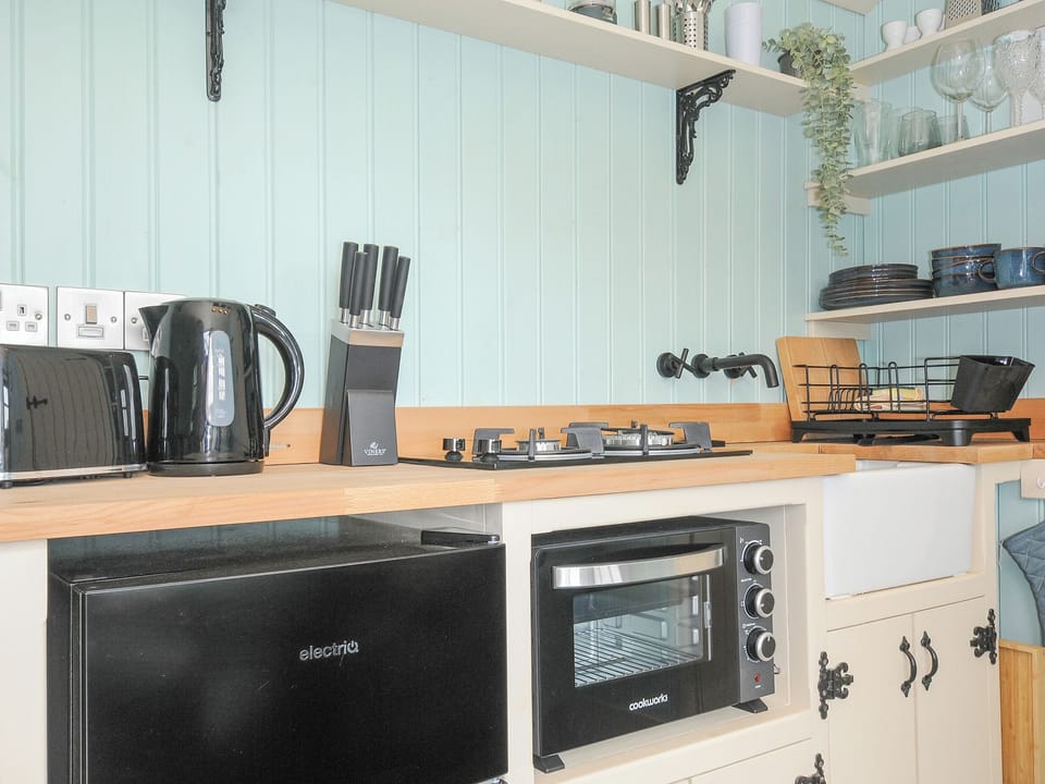 Fridge, toaster, cookware/dishes/utensils