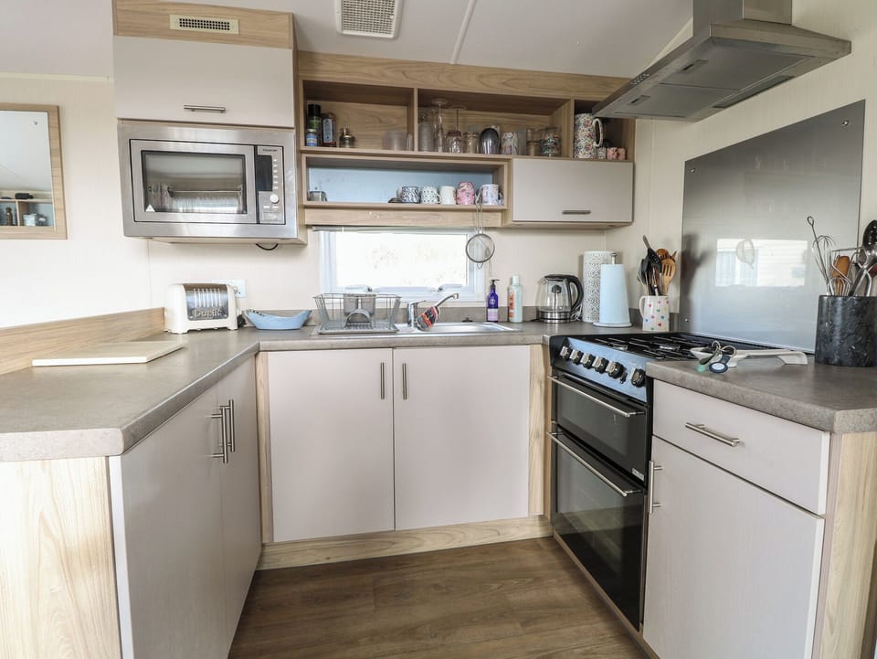 Fridge, electric kettle, toaster, cookware/dishes/utensils