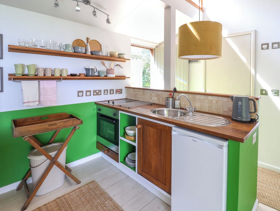 Fridge, electric kettle, toaster, cookware/dishes/utensils