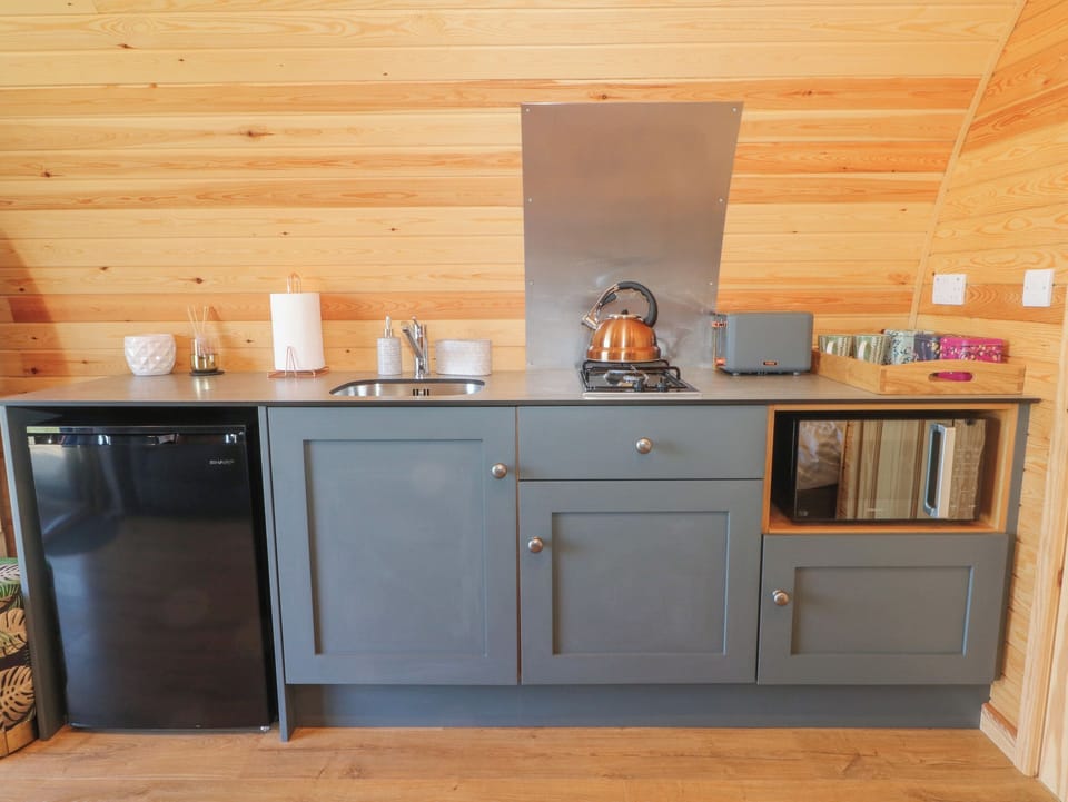 Fridge, electric kettle, toaster, cookware/dishes/utensils