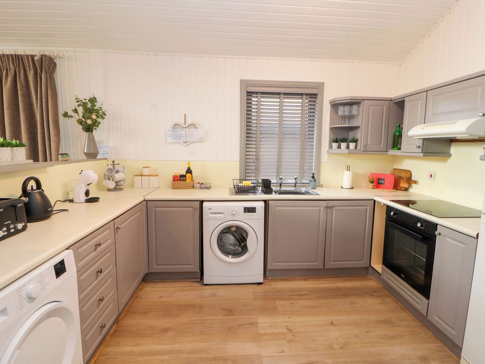 Fridge, electric kettle, toaster, cookware/dishes/utensils