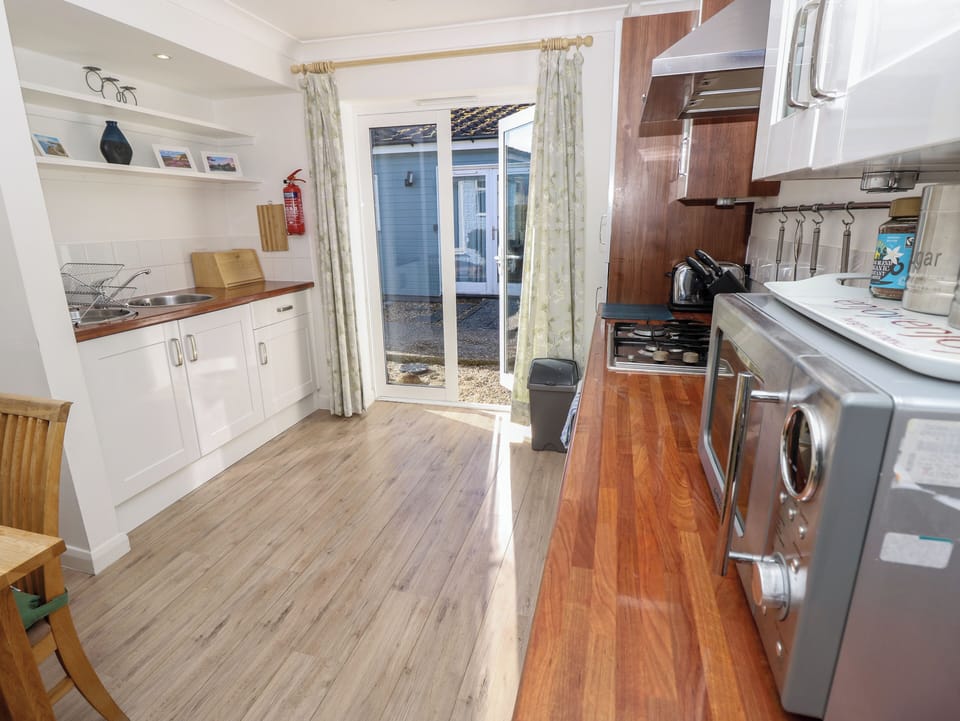 Fridge, microwave, toaster, cookware/dishes/utensils