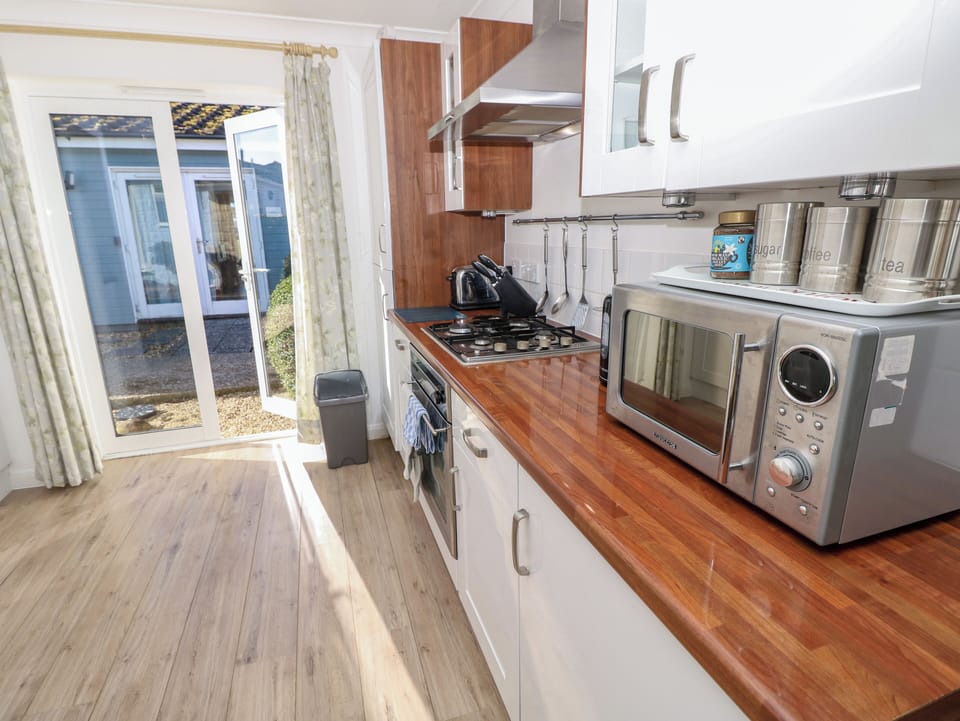Fridge, microwave, toaster, cookware/dishes/utensils