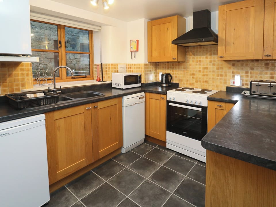 Fridge, electric kettle, toaster, cookware/dishes/utensils