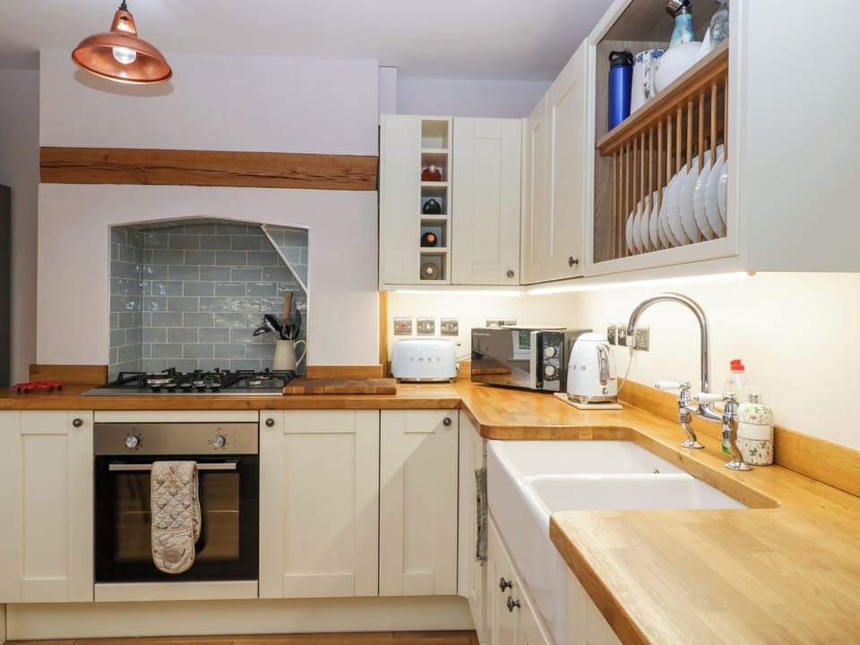 Fridge, electric kettle, toaster, cookware/dishes/utensils