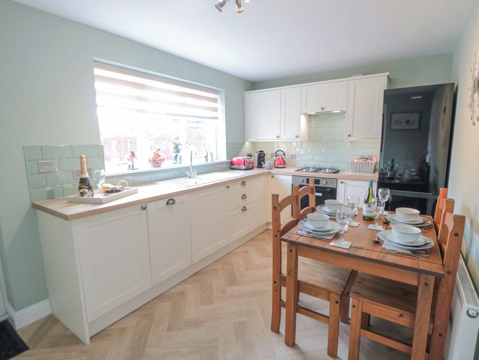 Fridge, electric kettle, cookware/dishes/utensils