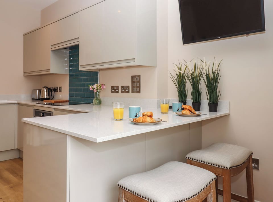 Fridge, electric kettle, cookware/dishes/utensils