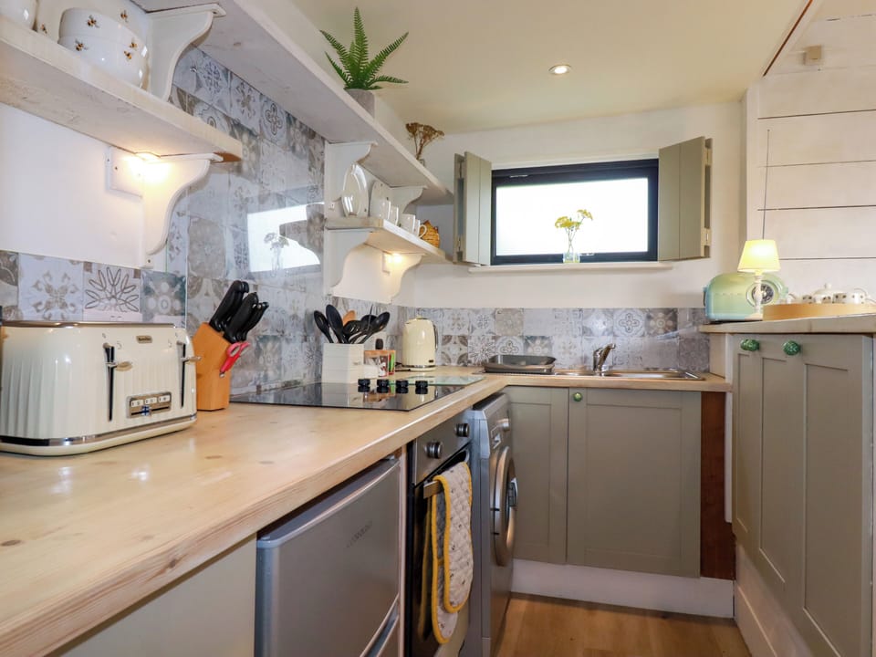 Fridge, toaster, cookware/dishes/utensils