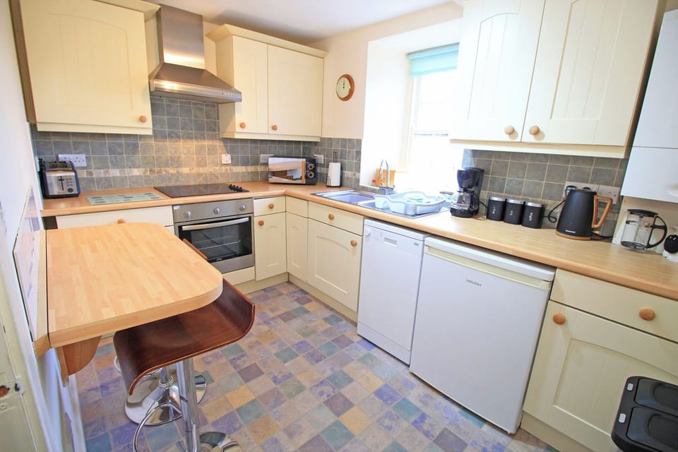 Fridge, dishwasher, electric kettle, cookware/dishes/utensils
