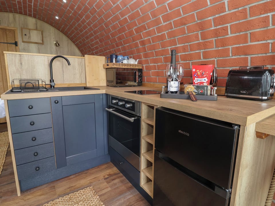 Fridge, electric kettle, toaster, cookware/dishes/utensils