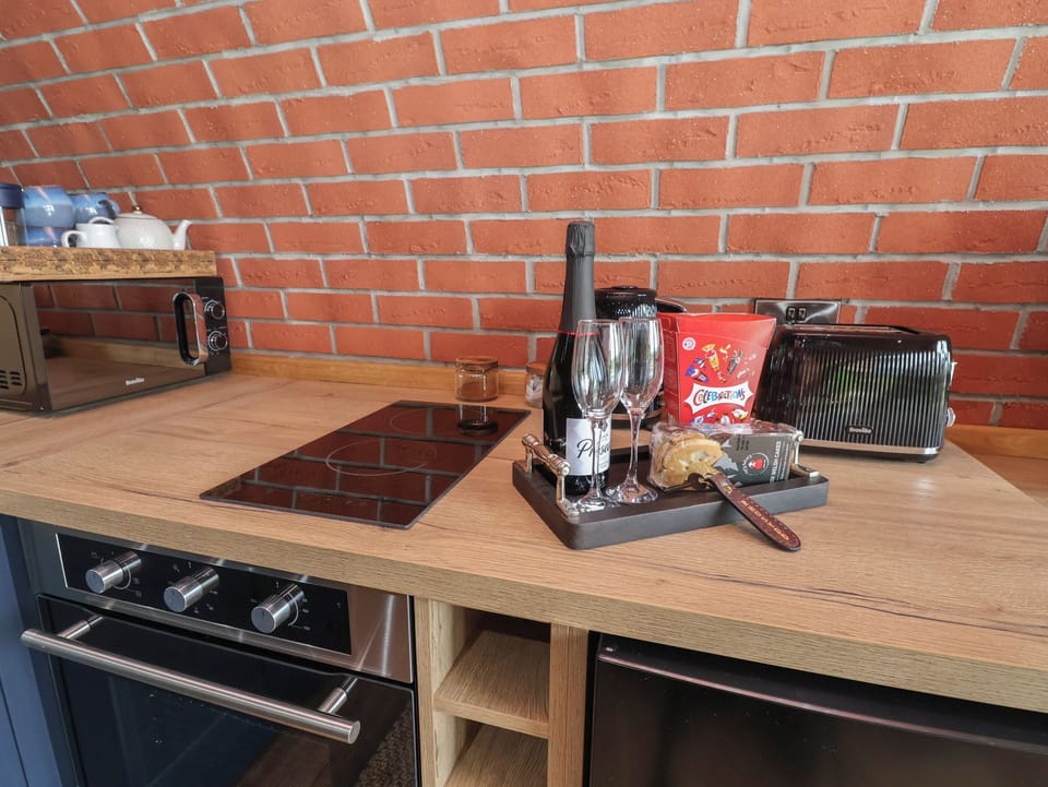 Fridge, electric kettle, toaster, cookware/dishes/utensils