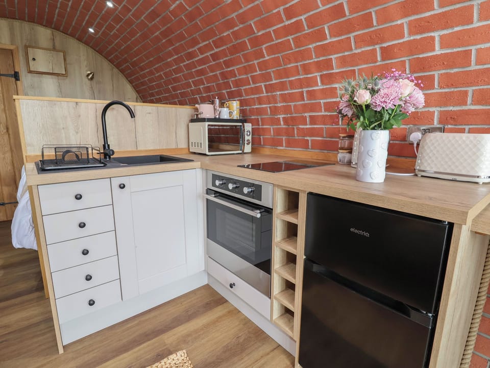 Fridge, electric kettle, toaster, cookware/dishes/utensils