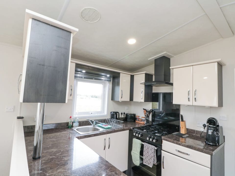 Fridge, electric kettle, cookware/dishes/utensils