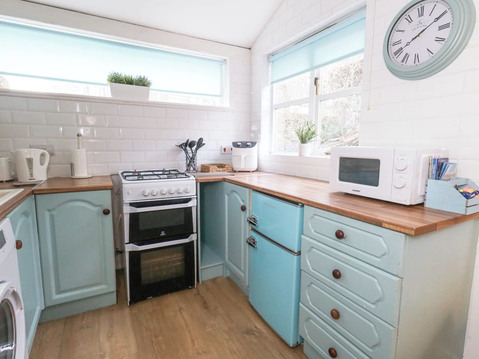 Fridge, microwave, toaster, cookware/dishes/utensils