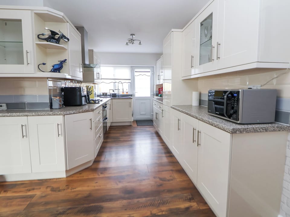 Fridge, electric kettle, toaster, cookware/dishes/utensils