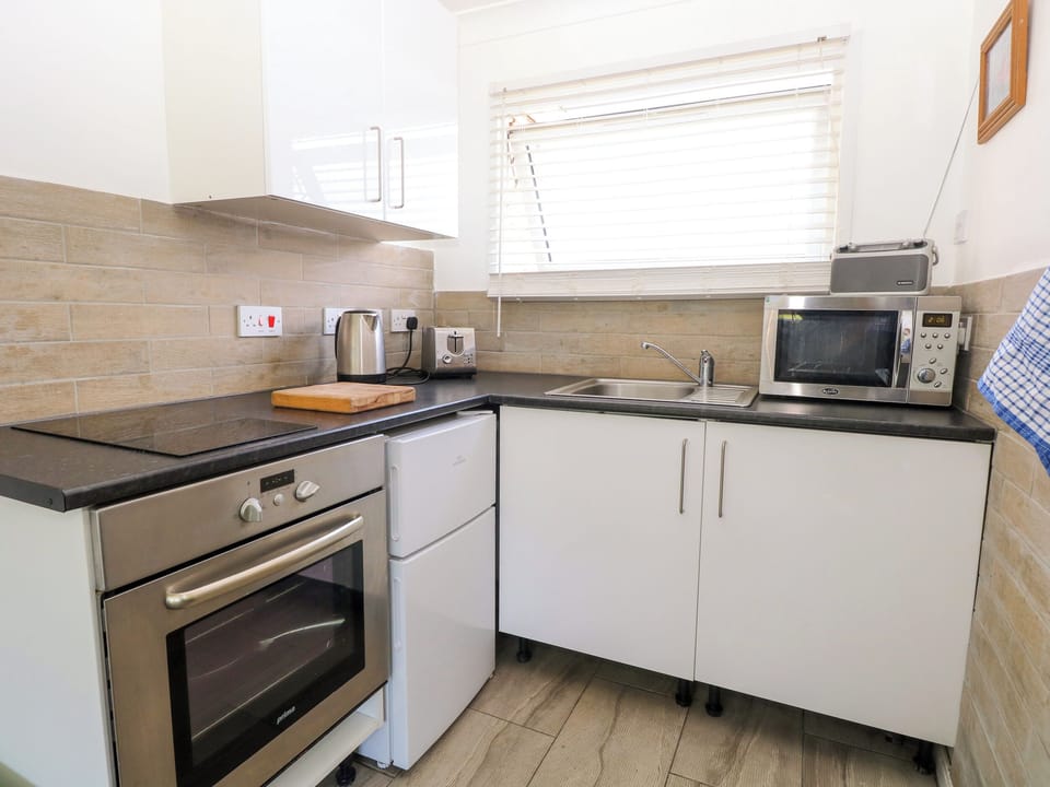 Fridge, electric kettle, toaster, cookware/dishes/utensils