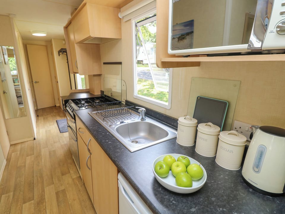 Fridge, electric kettle, toaster, cookware/dishes/utensils