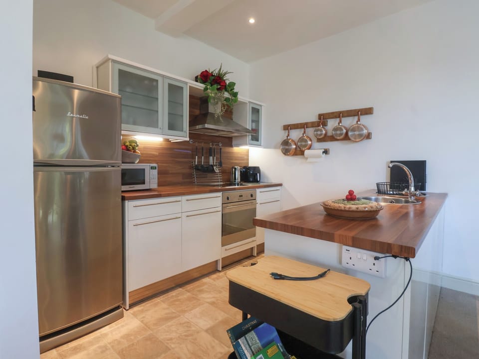 Fridge, electric kettle, cookware/dishes/utensils