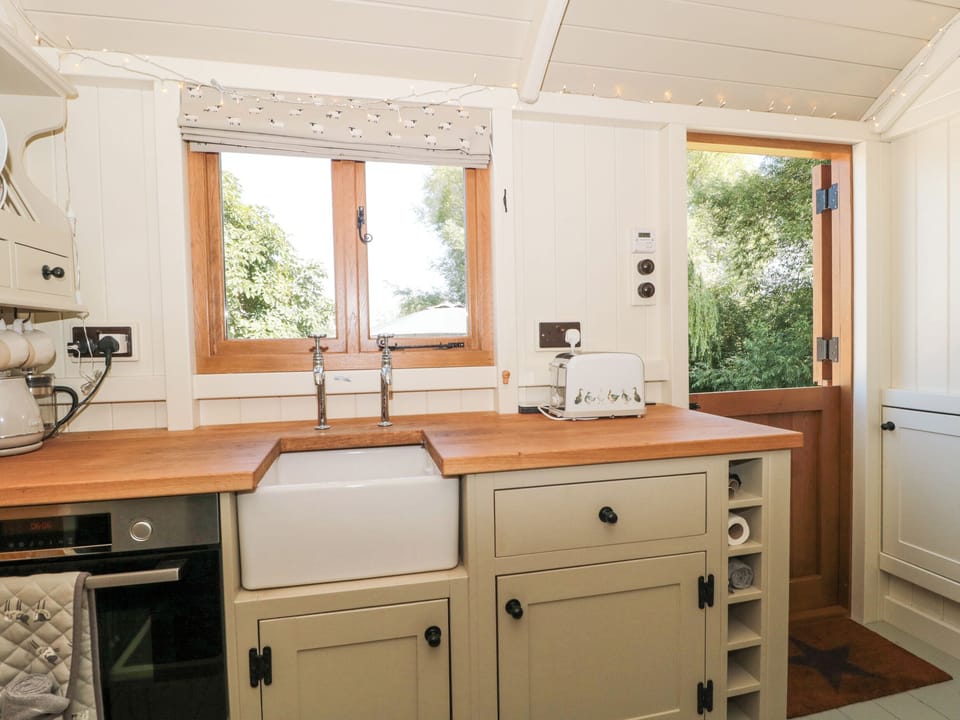Fridge, electric kettle, toaster, cookware/dishes/utensils