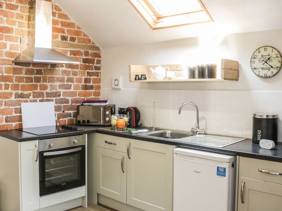 Fridge, electric kettle, cookware/dishes/utensils