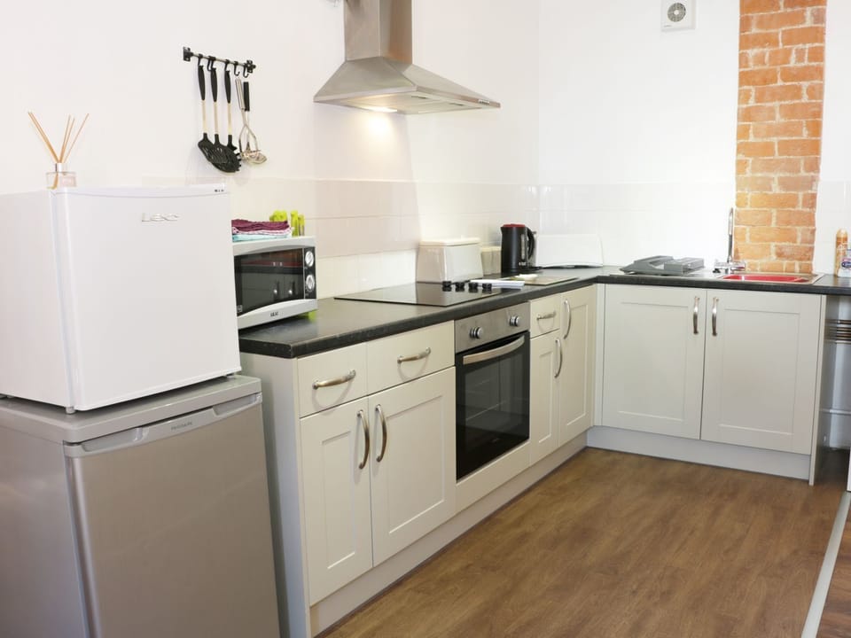 Fridge, electric kettle, cookware/dishes/utensils