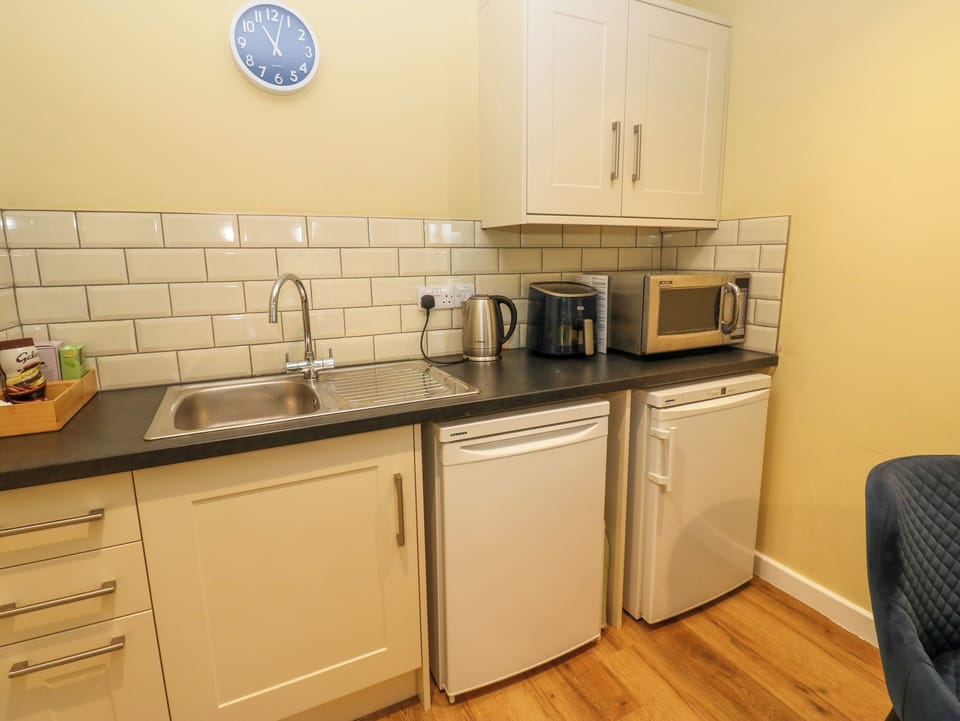 Fridge, electric kettle, toaster, cookware/dishes/utensils