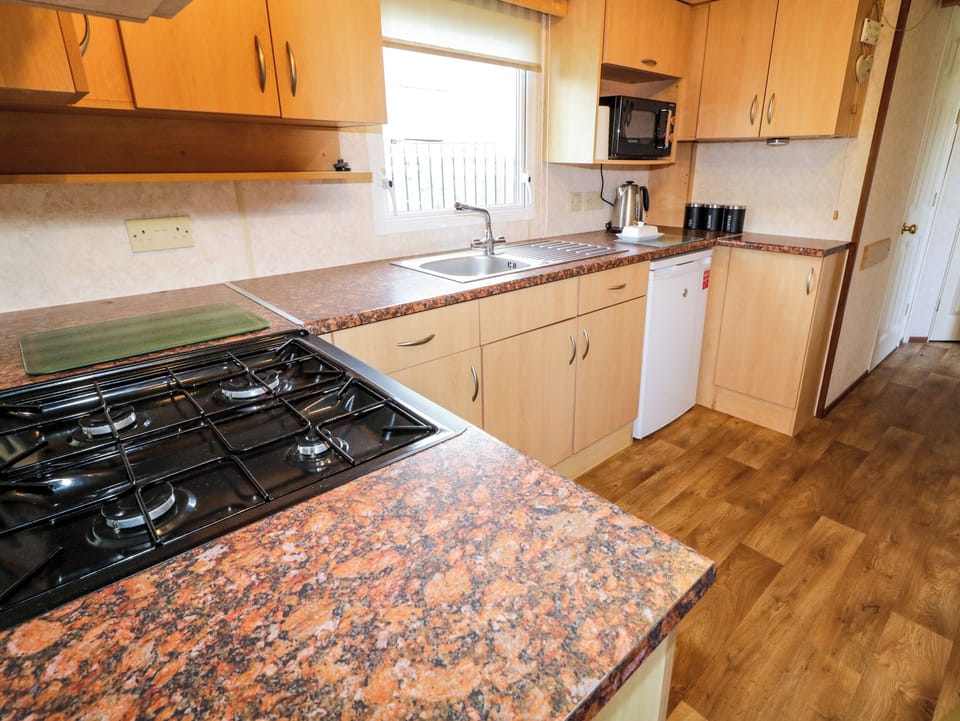 Fridge, electric kettle, cookware/dishes/utensils