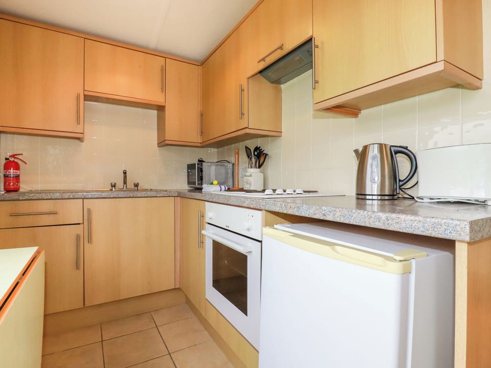 Fridge, electric kettle, cookware/dishes/utensils