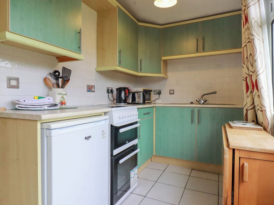 Fridge, electric kettle, cookware/dishes/utensils