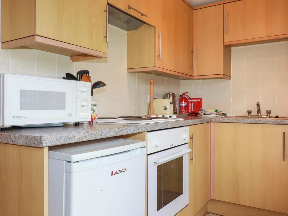 Fridge, electric kettle, cookware/dishes/utensils