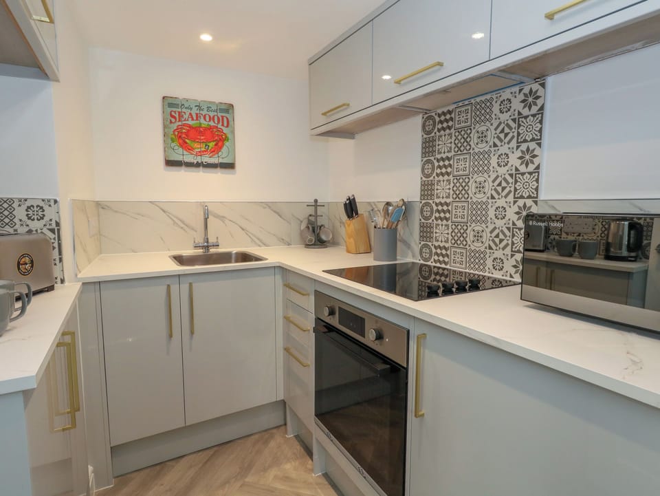 Fridge, electric kettle, toaster, cookware/dishes/utensils