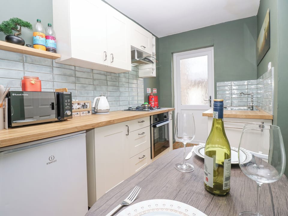 Fridge, electric kettle, toaster, cookware/dishes/utensils
