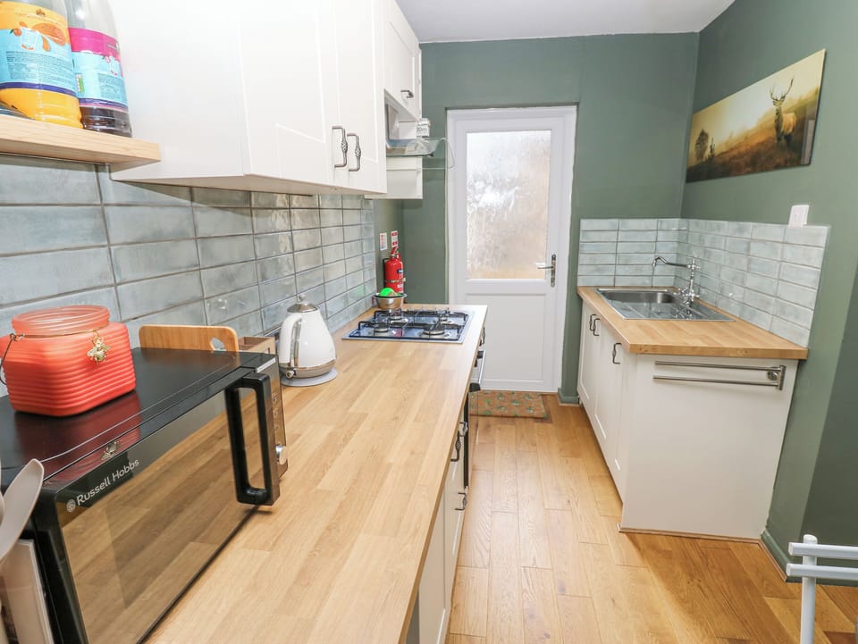 Fridge, electric kettle, toaster, cookware/dishes/utensils