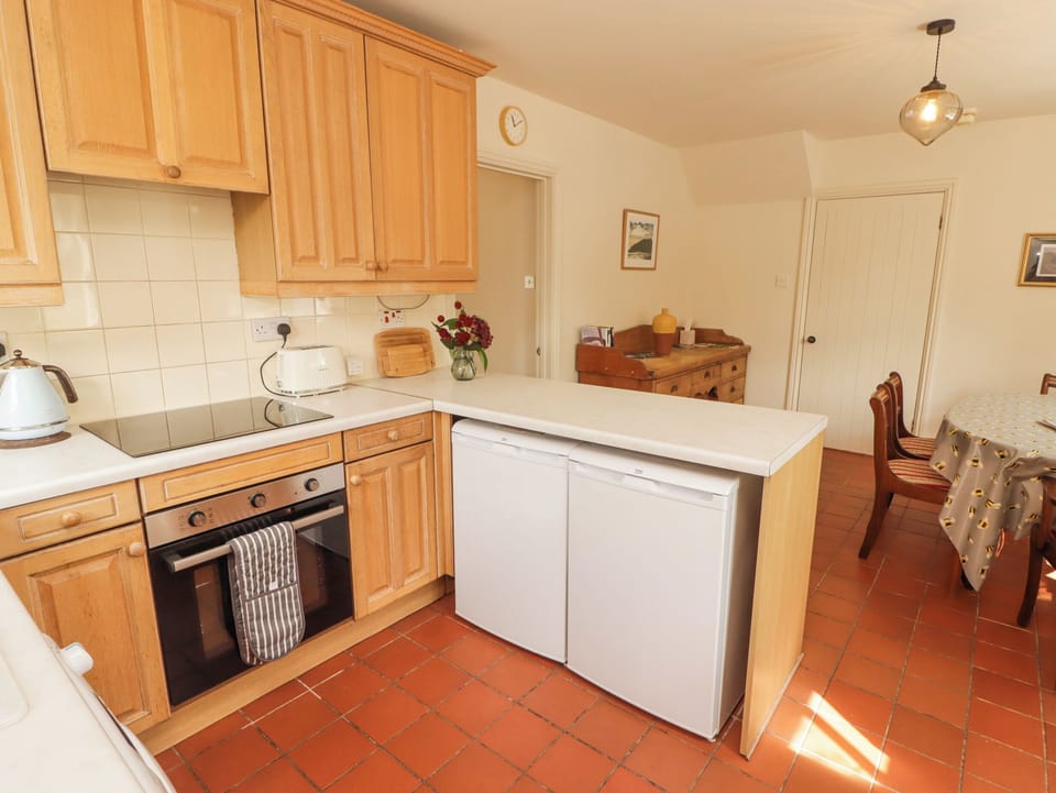 Fridge, electric kettle, toaster, cookware/dishes/utensils
