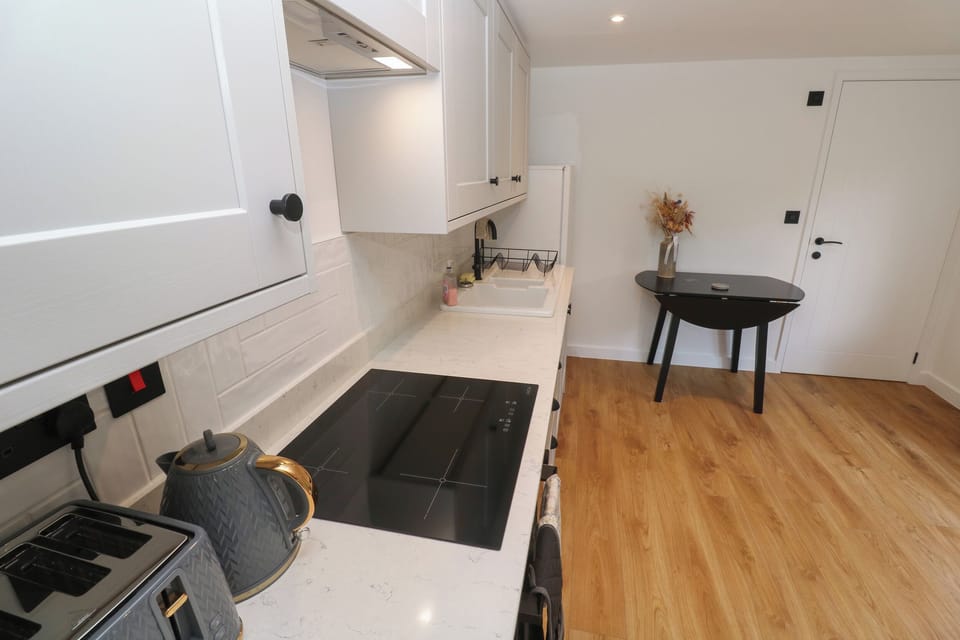 Fridge, electric kettle, toaster, cookware/dishes/utensils