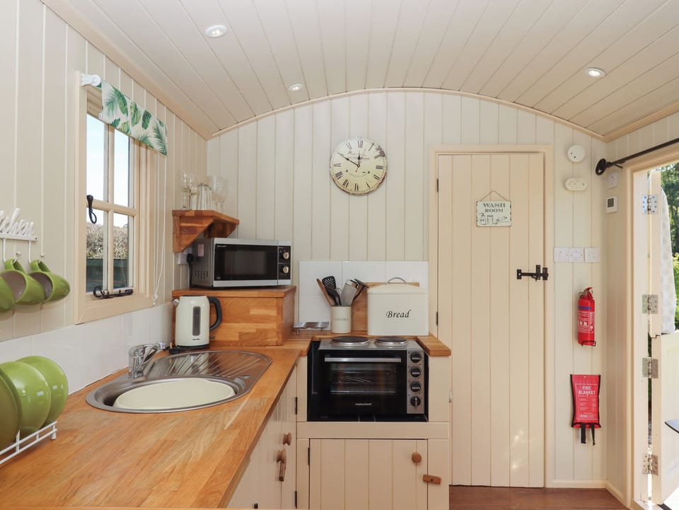 Fridge, electric kettle, cookware/dishes/utensils