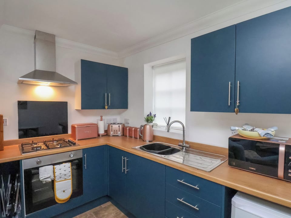 Fridge, electric kettle, toaster, cookware/dishes/utensils